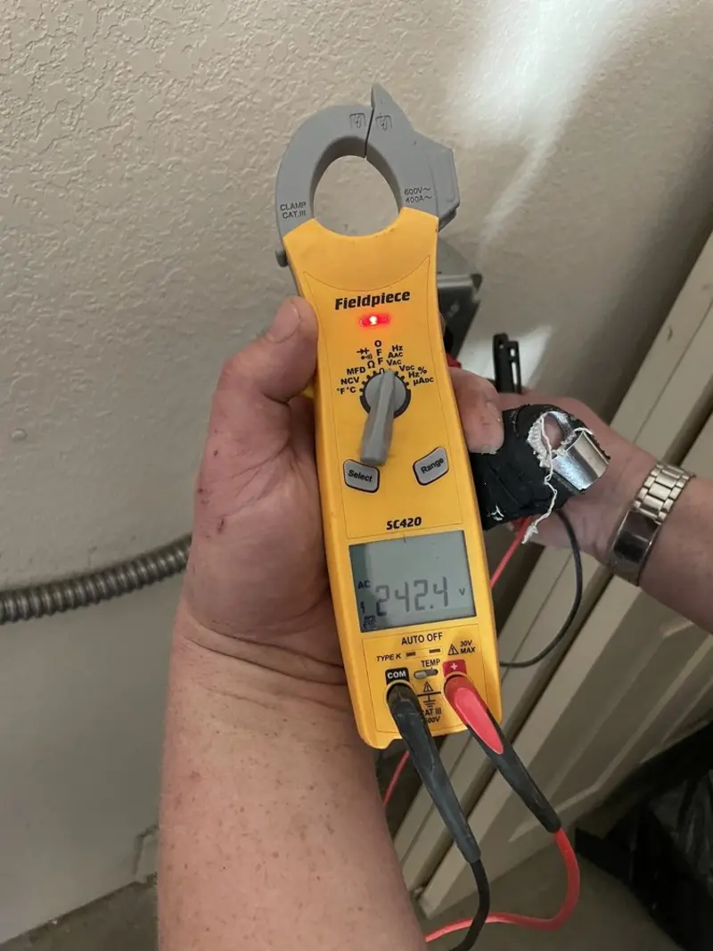 Voltage testing with clamp meter during Electrical Installation Services in Sparta